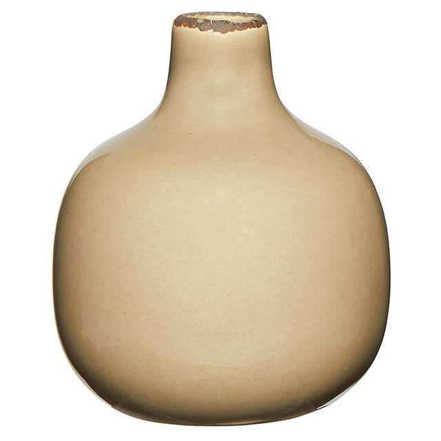 Small ceramic vase with a rounded silhouette in neutral tone.