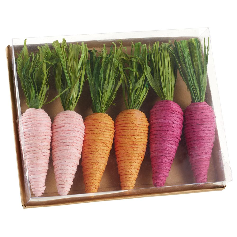 Pink carrot-shaped planter box made from paper, cornhusk, and polyfoam.