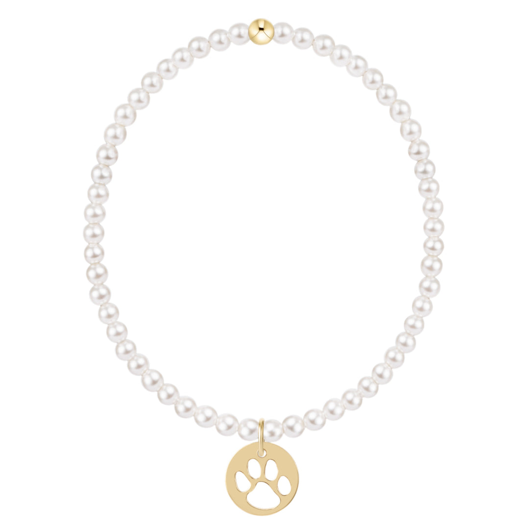 Classic 3mm pearl bracelet with a gold bead and a gold disc charm featuring a paw print cutout.