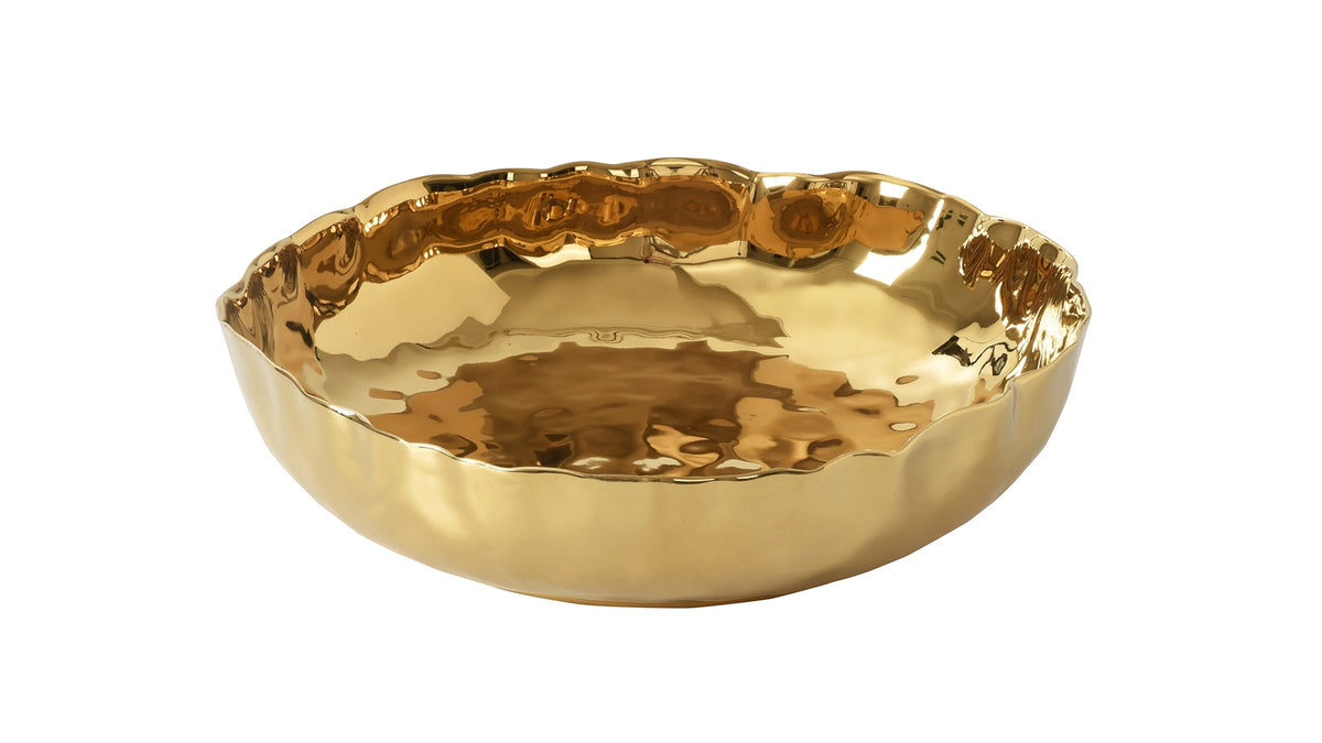 Extra large shallow gold porcelain bowl with a hammered texture and wavy rim.