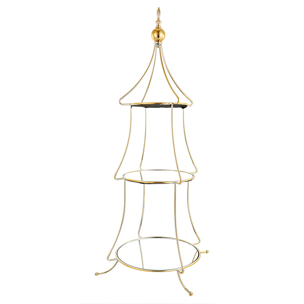 Gold tiered tree-shaped accessory stand with three levels holding decorative items.