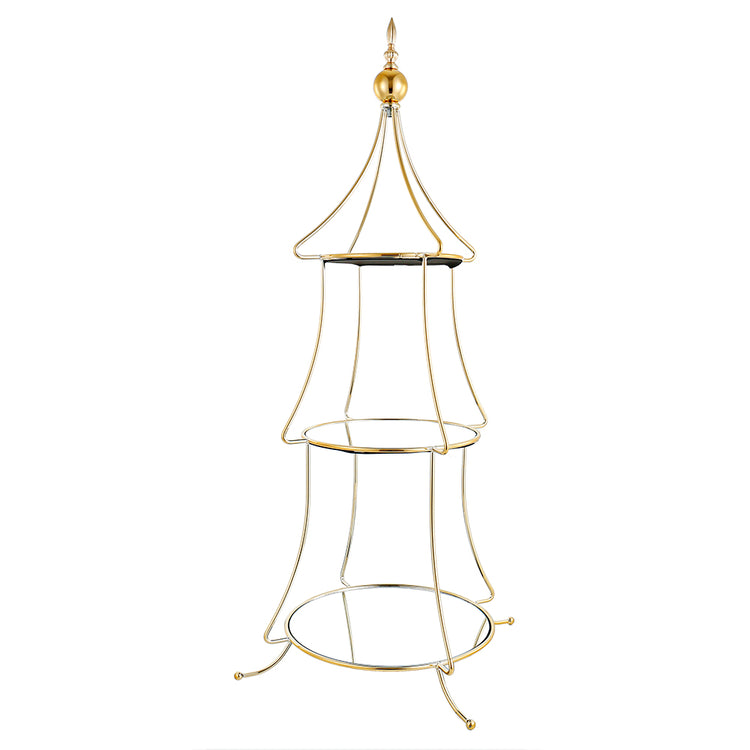 Gold tiered tree-shaped accessory stand with three levels holding decorative items.