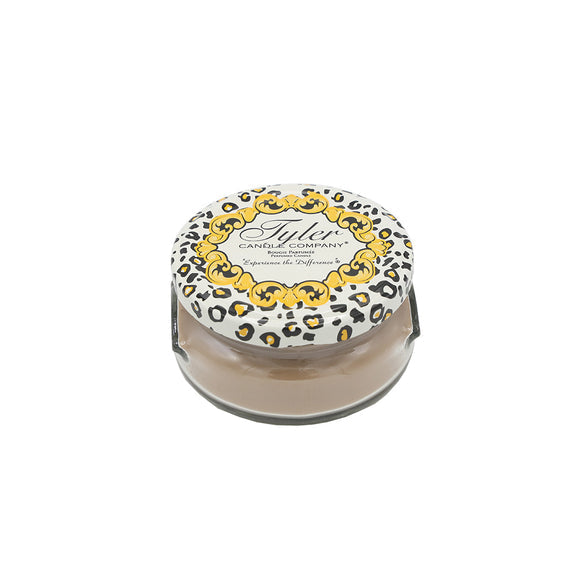 Tyler Candle Company 3.4oz candle in a glass jar with a leopard print lid and gold filigree design.