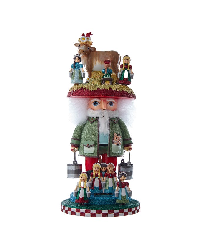 16.5-inch Hollywood 8 Maids A Milking Nutcracker with a cow on top and milkmaids around the base.