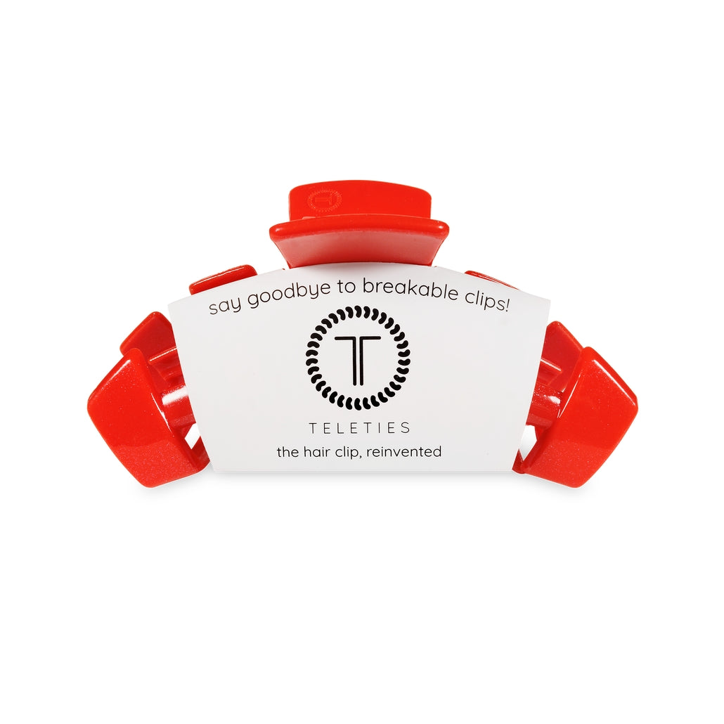 Medium-sized classic hair clip with a natural finish.