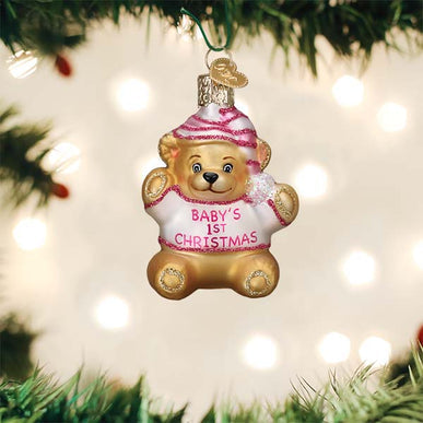 Small cinnamon-colored teddy bear ornament with black button eyes.