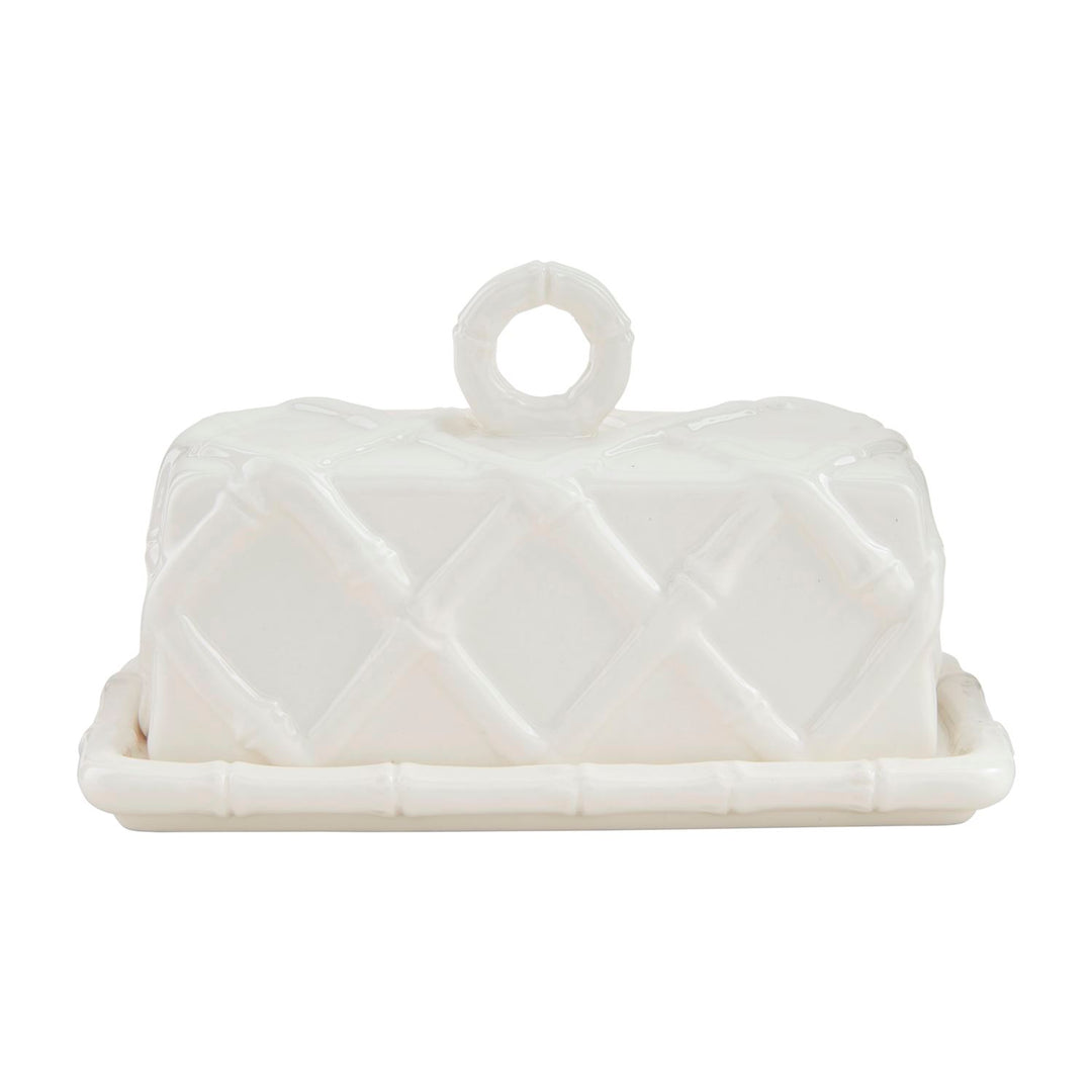 White stoneware butter dish with a raised bamboo lattice design and a ring handle on the lid.