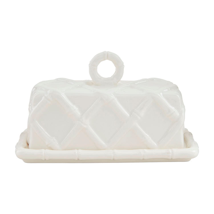 White stoneware butter dish with a raised bamboo lattice design and a ring handle on the lid.