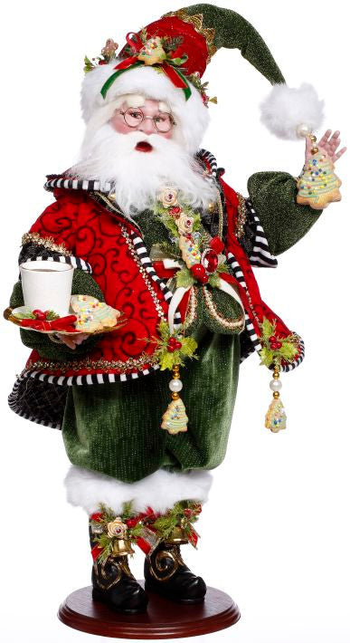 Decorative Cookies and Milk Santa figurine in a red and green outfit holding a tray and a cookie.