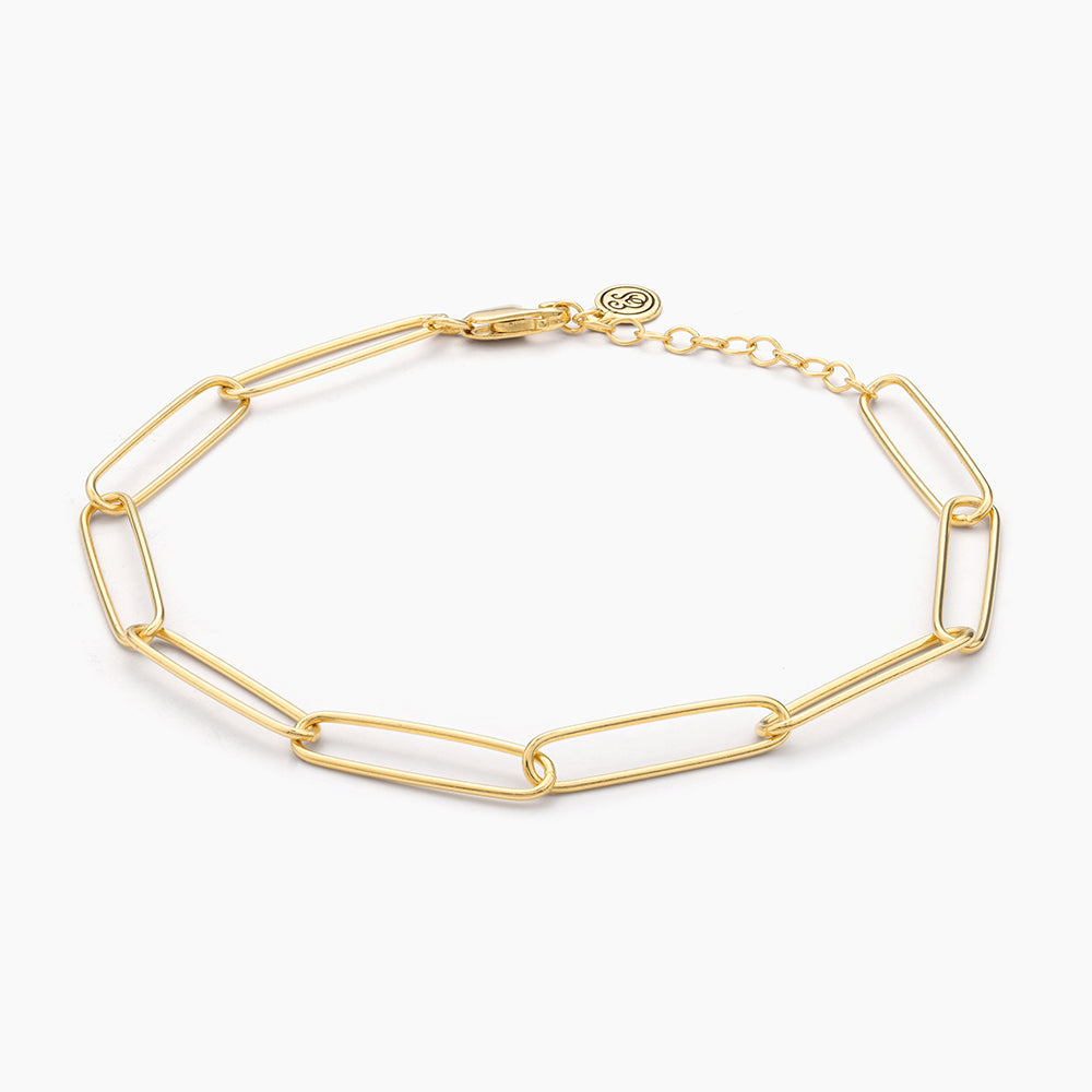 Paperclip chain bracelet in gold-plated sterling silver with a lobster clasp closure.