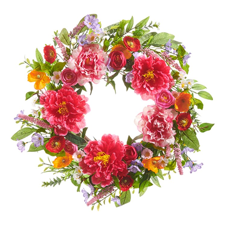 A round floral wreath made of grapevine with colorful flowers on a white background.