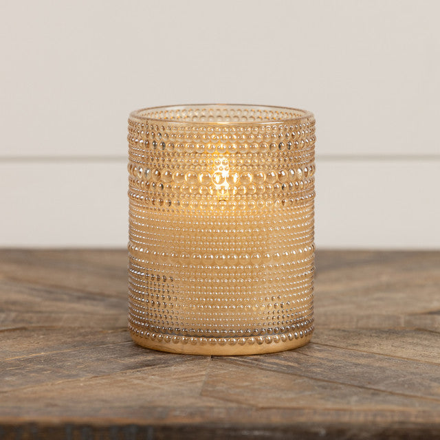 Five-inch champagne glass candle with dotted pattern featuring a three-dimensional flame shape.