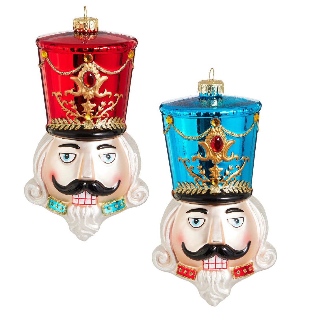 7.25-inch glass nutcracker head ornaments in red and blue with gold glitter details.