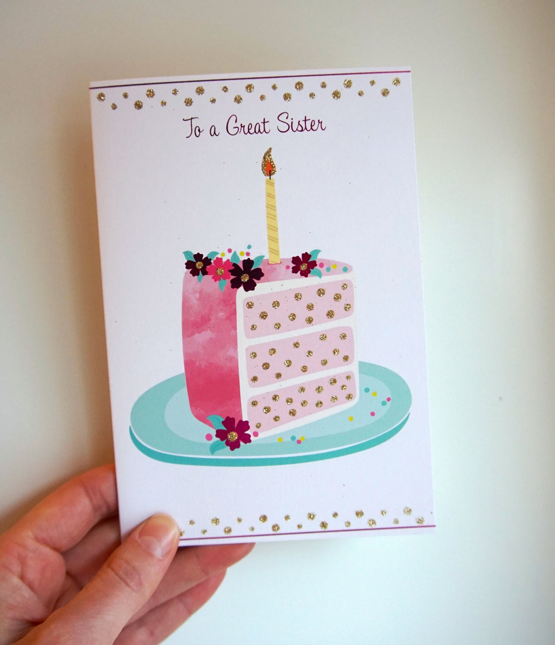 Pink foil birthday cake slice with glitter accents featuring 'BD Sister' outside text and a wish message inside.