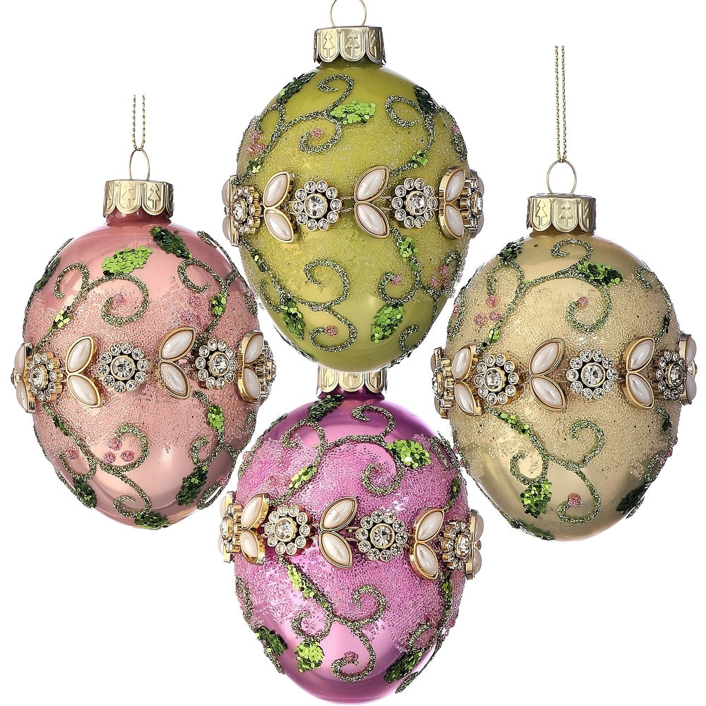 Glass egg ornament with a jewel-like fleurette floral design in clear glass.