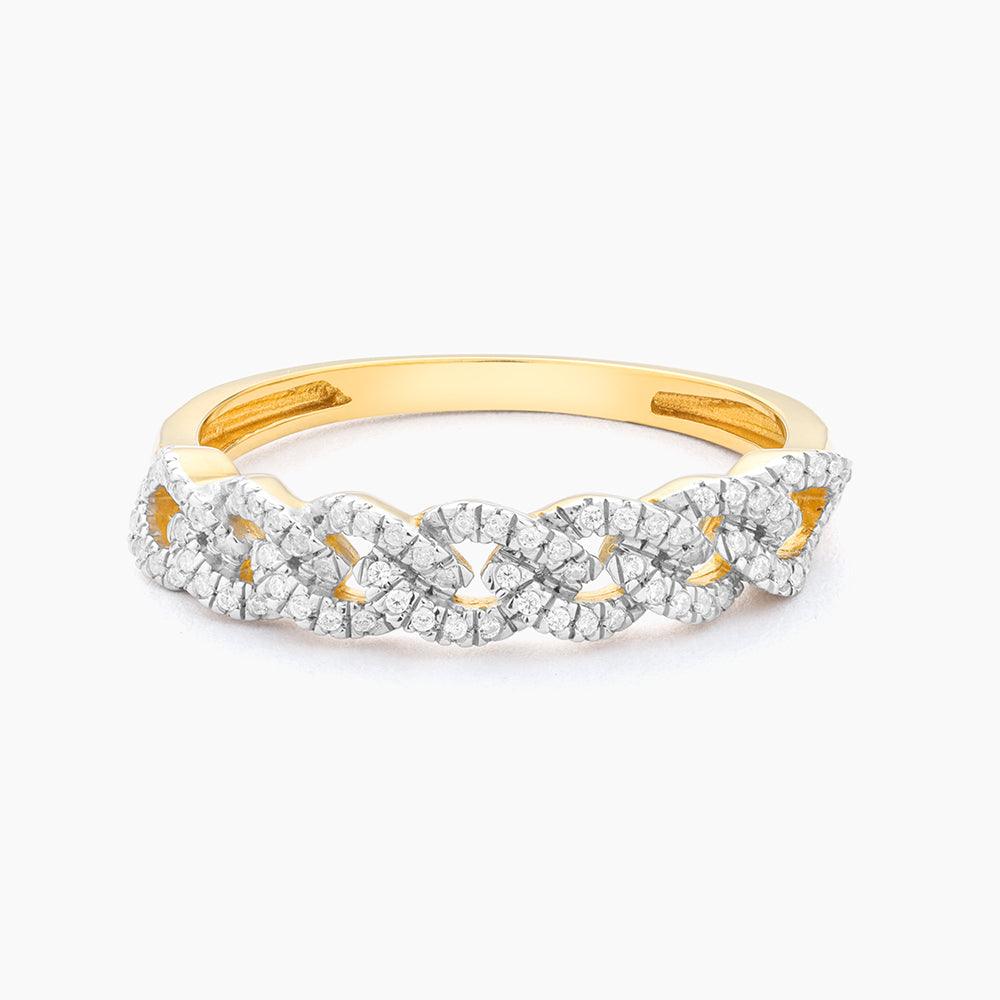 Stackable ring with a braided texture in gold-tone metal featuring an embedded flower accent.