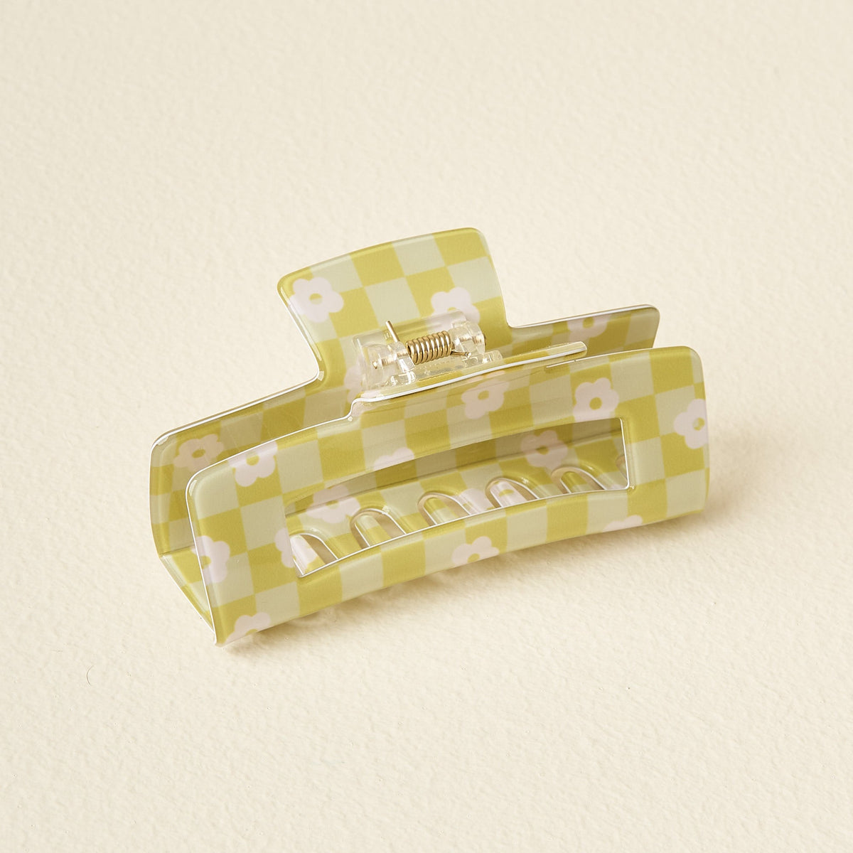 Clear plastic check claw clip with printed checkerboard pattern