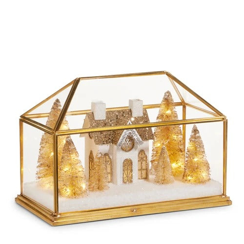 10.75-inch gold house terrarium with a lighted miniature white house and gold bottle brush trees.