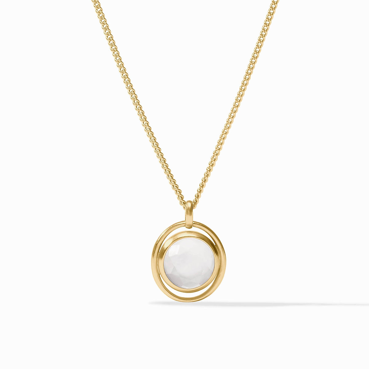 Adjustable Laguna Solitaire necklace featuring a clear imported glass pendant on 24K gold plate chain.