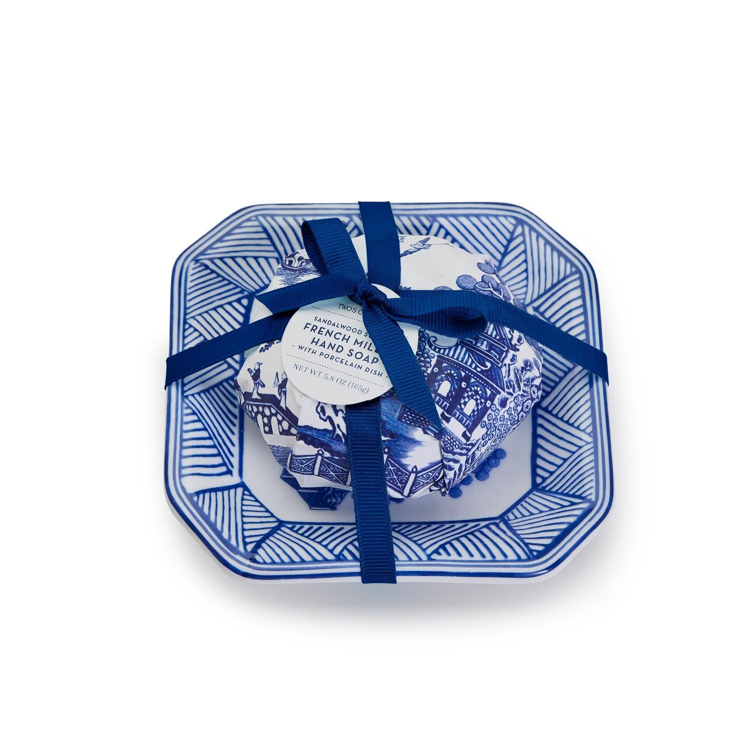 Blue Willow sandalwood scented soap wrapped in blue and white paper on a matching porcelain tray.
