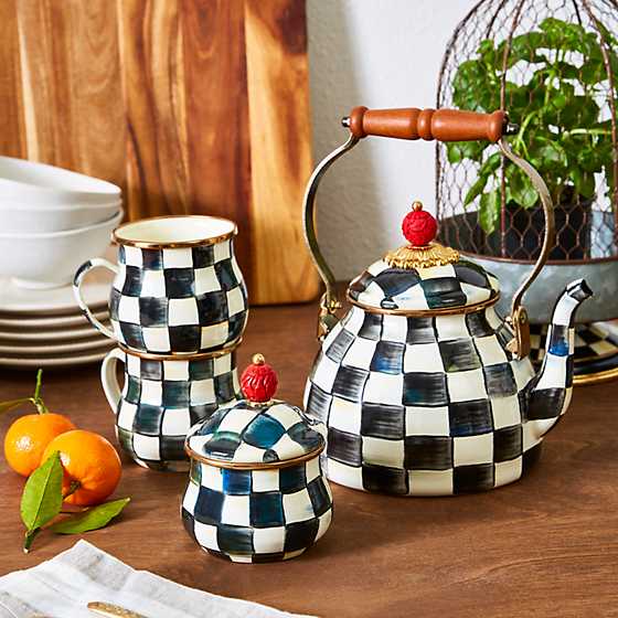 Enamel tea kettle with Courtly Check floral pattern on steel body, wood handle, and brass lid accents.
