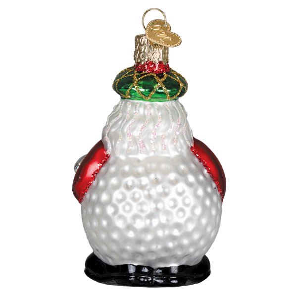 Red Santa golf ornament swinging a club with a ball on the green.