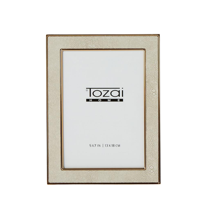 Cream faux shagreen photo frame with gold steel trim and Tozai Home insert.