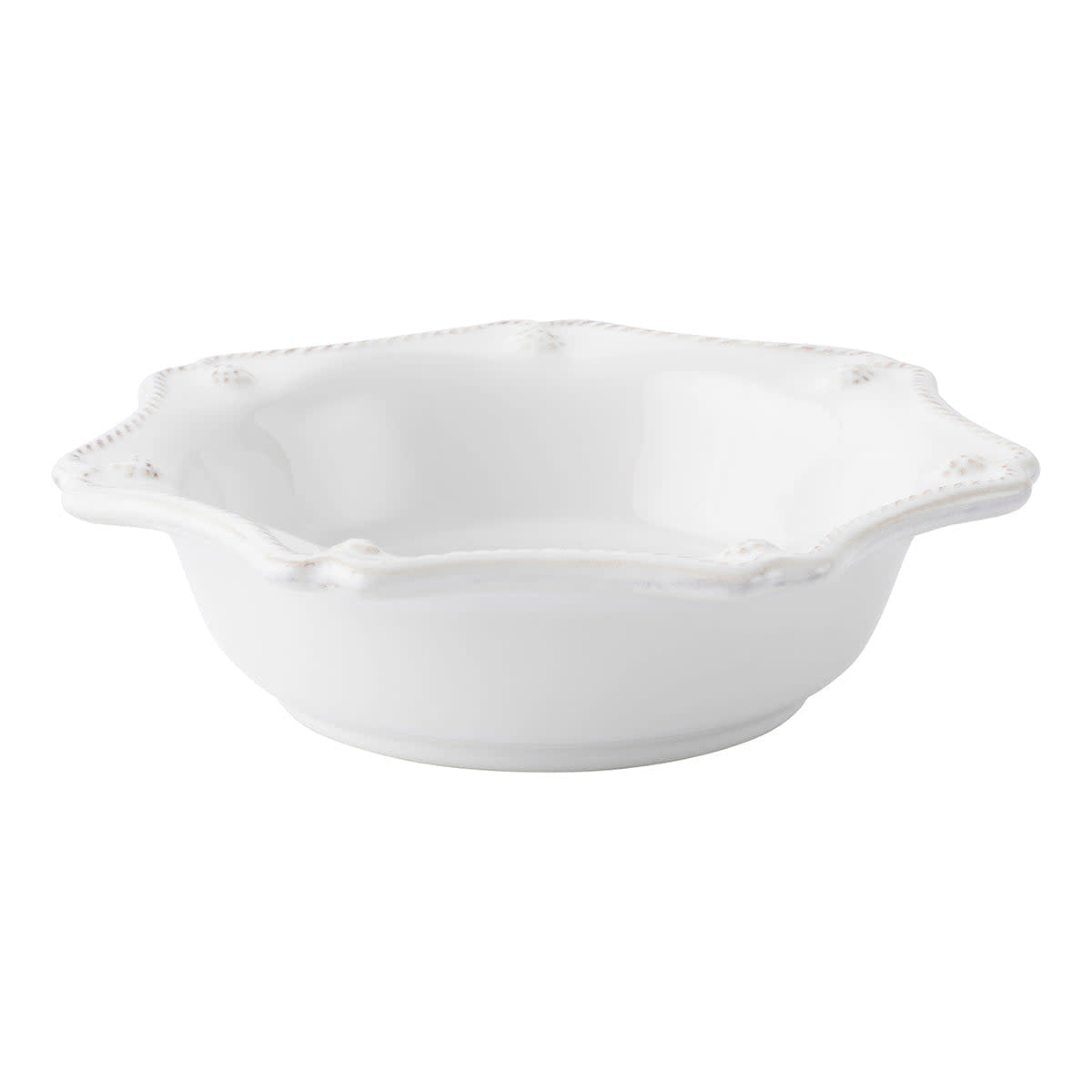 White ceramic pie dish with scalloped rim featuring rustic thread and berry motif