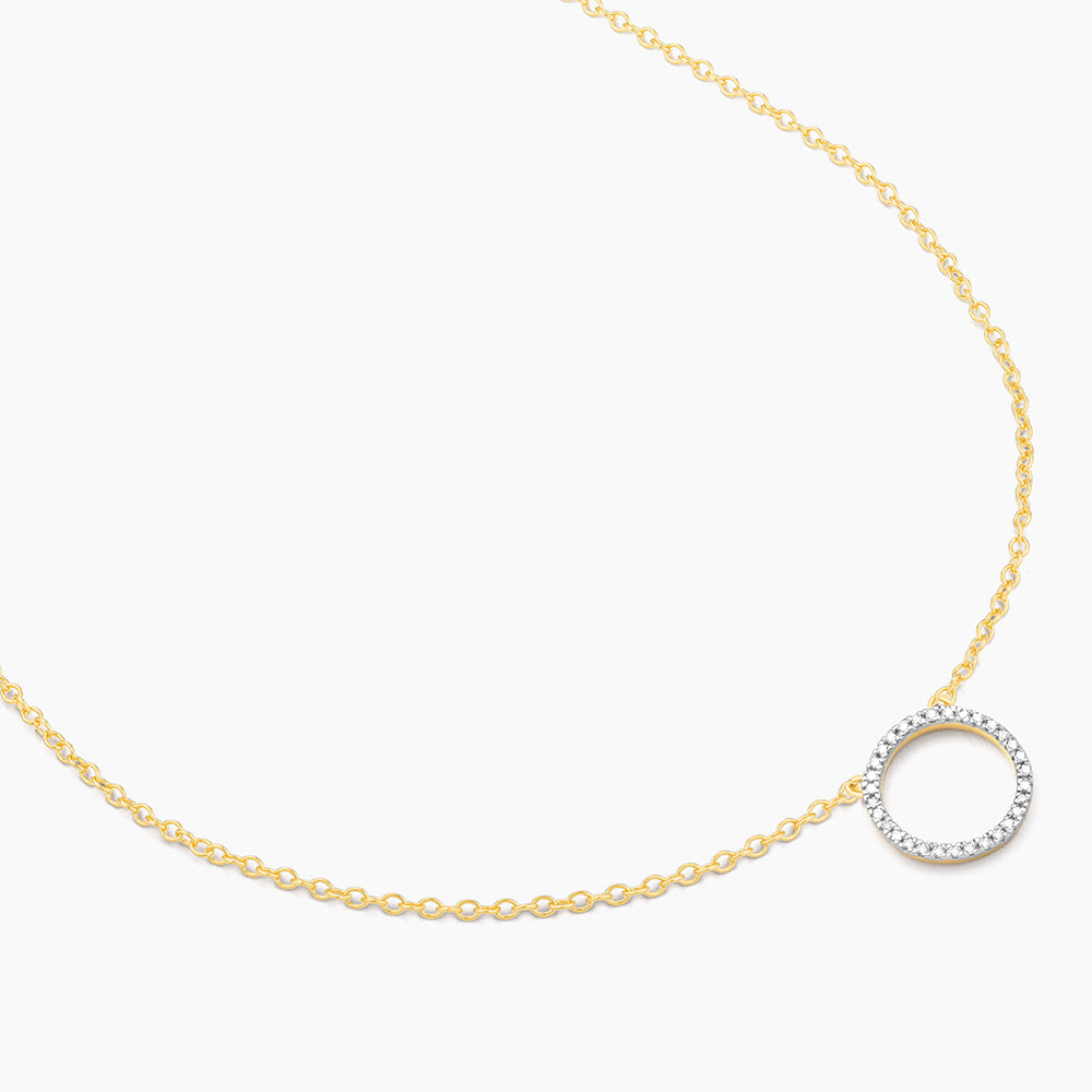 Standing O Pendant Necklace in 14kt gold-plated silver with a diamond-encrusted circular pendant.