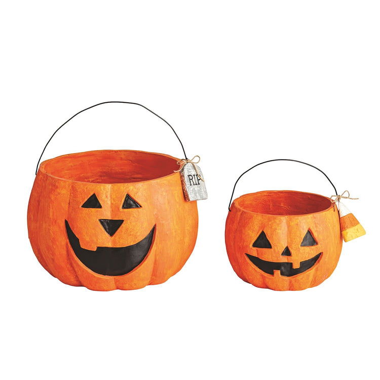 Paper mache Jack-O-Lantern treat bucket with carved pumpkin face pattern in orange and black.