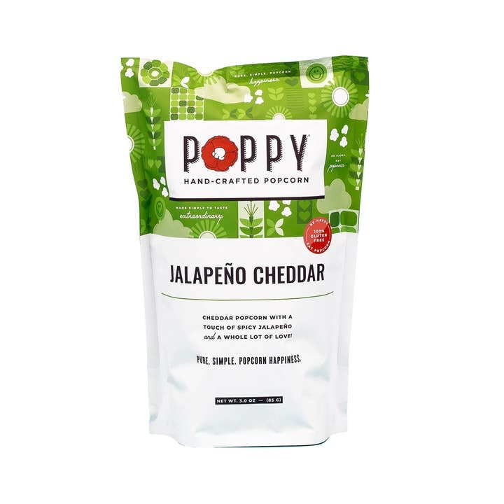 Front view of Market Bag Popcorn in white cheddar vinegar dill flavor with visible seasoning.
