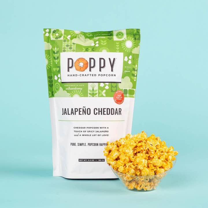 Open bag Market Bag Popcorn with white cheddar vinegar dill flavor showing yellow kernels