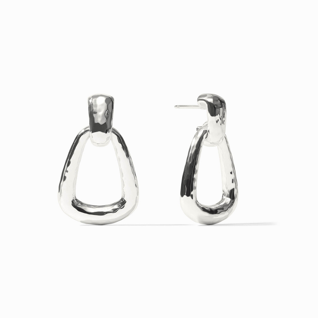 Pair of silver Sahara Demi Doorknocker Earrings with a hammered, organic finish.