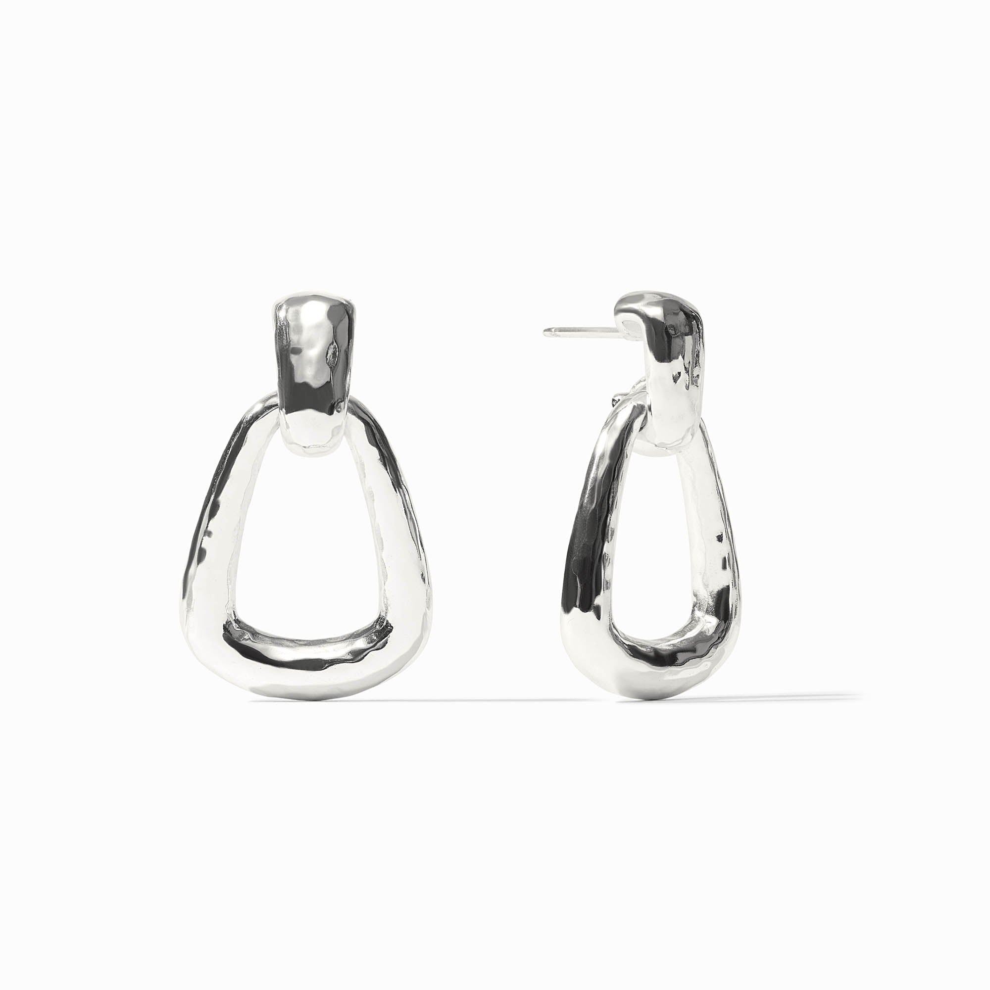 Pair of silver Sahara Demi Doorknocker Earrings with a hammered, organic finish.