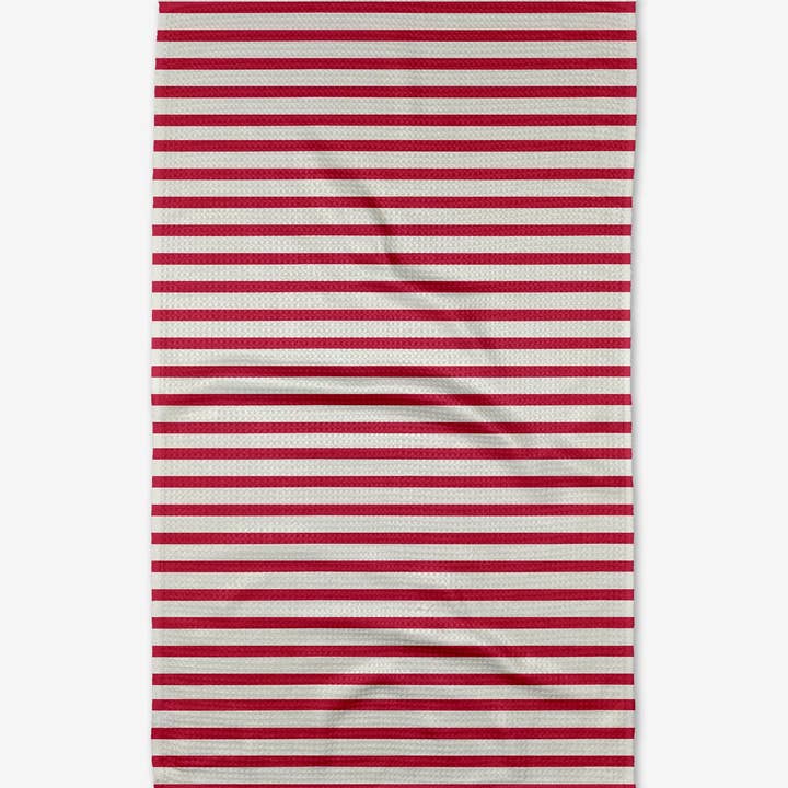 Recycled polyester waffle weave tea towel with single-sided print featuring a colorful floral pattern.