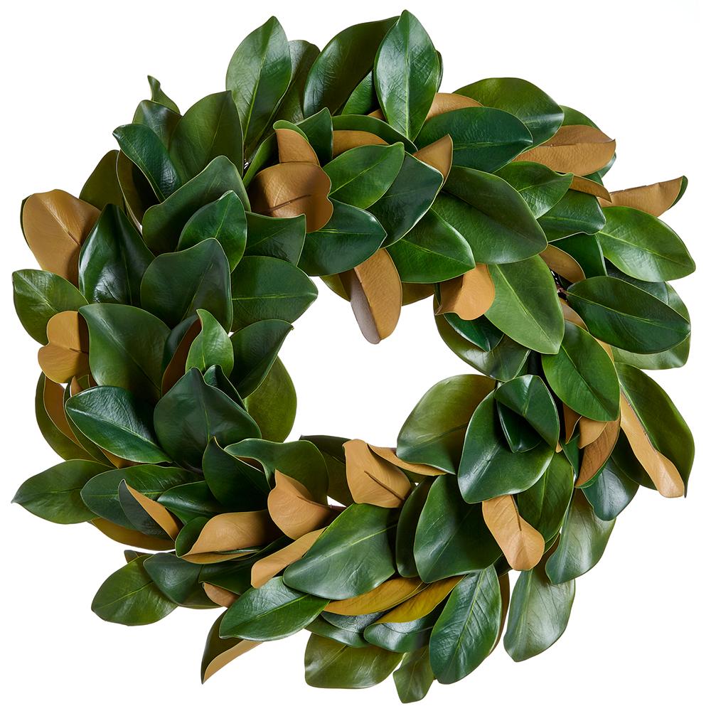 Green plastic wreath with magnolia leaf silhouettes on a circular wire frame.