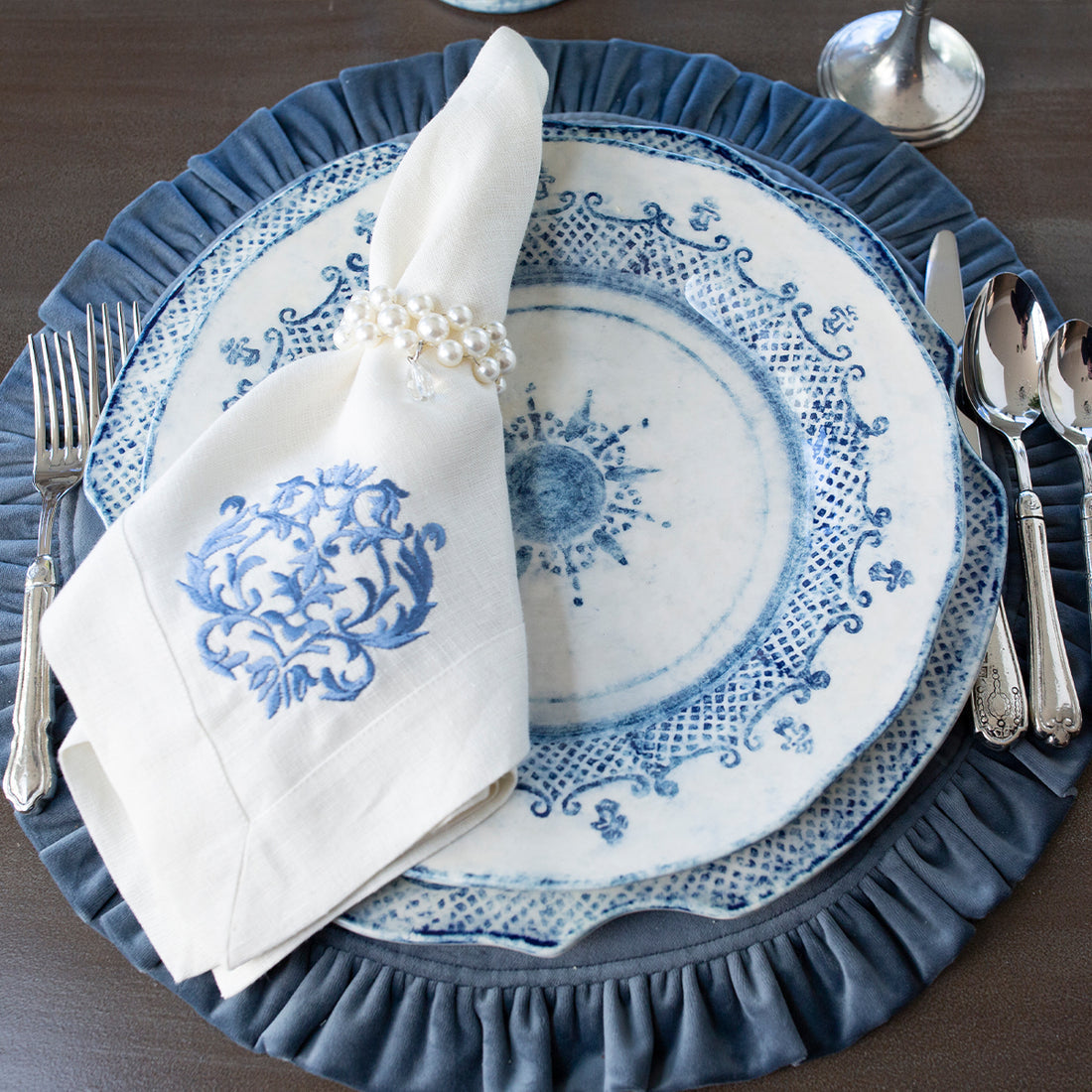 Round ruffle velvet placemat in a soft neutral tone with an 18-inch diameter.