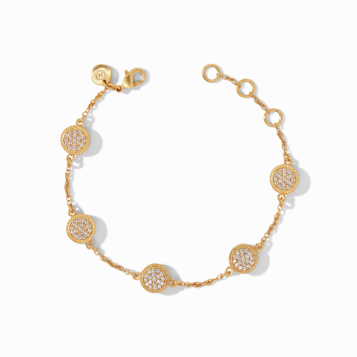 Gold chain bracelet with five circular pave cubic zirconia charms and an adjustable clasp.