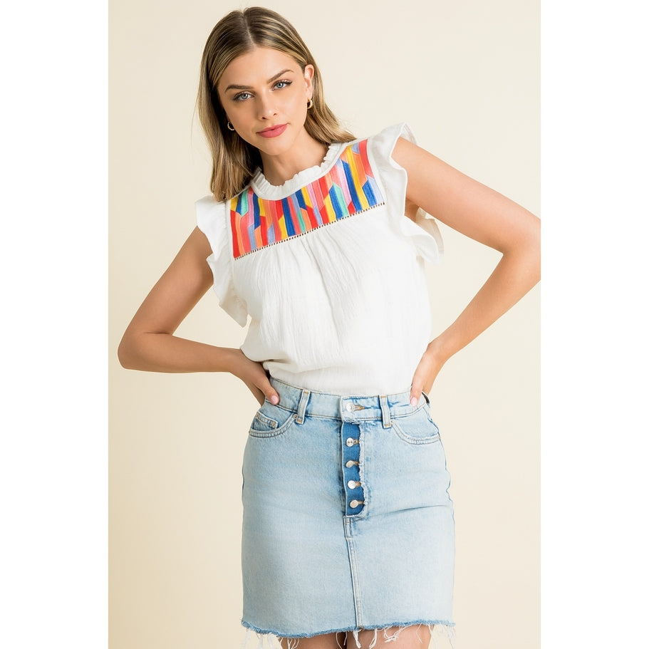 Woven cotton knit top with ruffle sleeves in a light neutral tone.