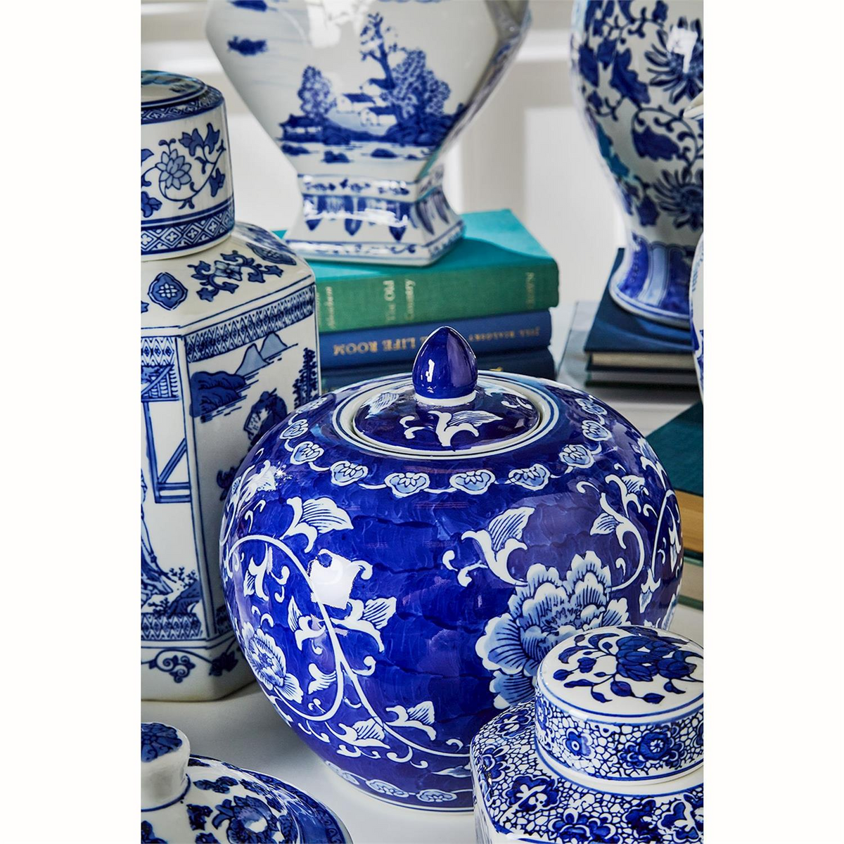 A collection of various blue and white Canton ceramic jars and vases with traditional patterns.