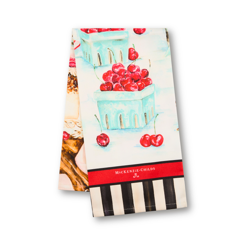 Cotton dish towel with cherry baskets, a red MacKenzie-Childs logo band, and black and white stripes.
