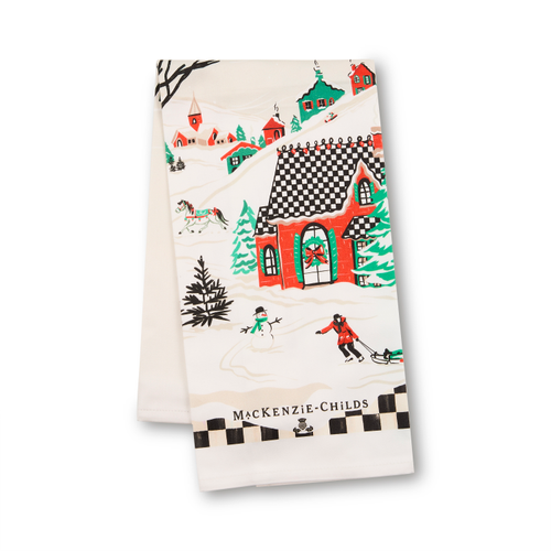Alpine Village Printed Dish Towel featuring a snowy scene with houses, a snowman, and a sledder.