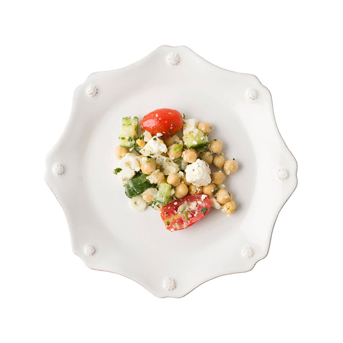 Whitewash ceramic scallop salad plate featuring a subtle berry and thread motif with an elegant curved silhouette.