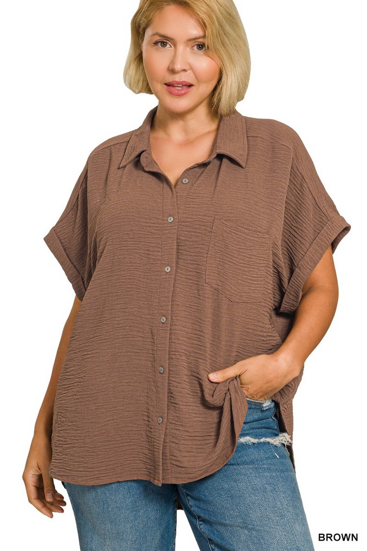 Plus size brown woven airflow button-down shirt with short sleeves and a front pocket.