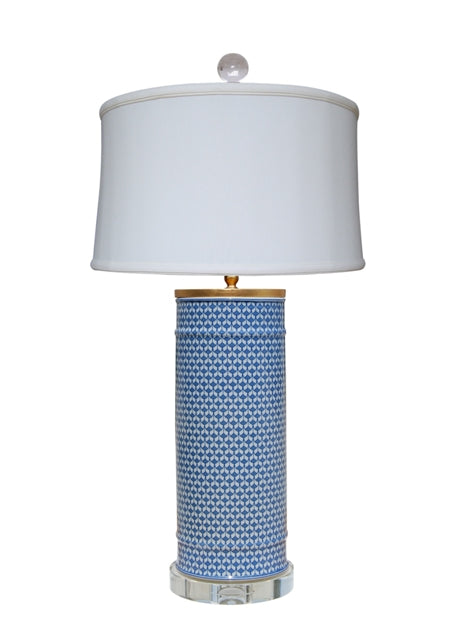 Blue and white porcelain fish scale pattern lamp with a crystal base and off-white drum shade.