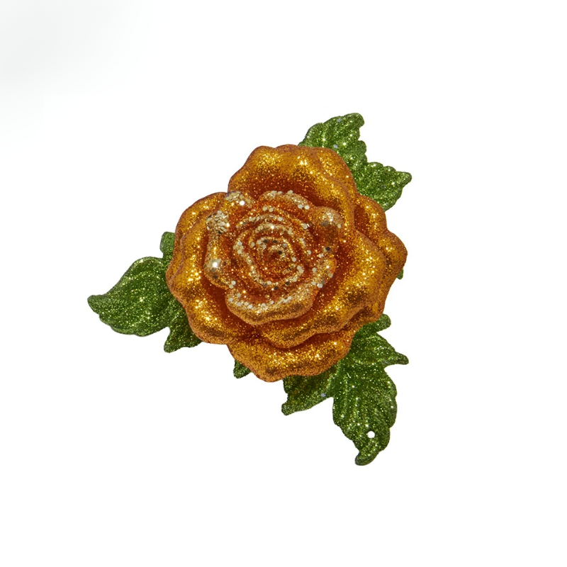 Gold glitter rose clip-on ornament with green glitter leaves on a white background.