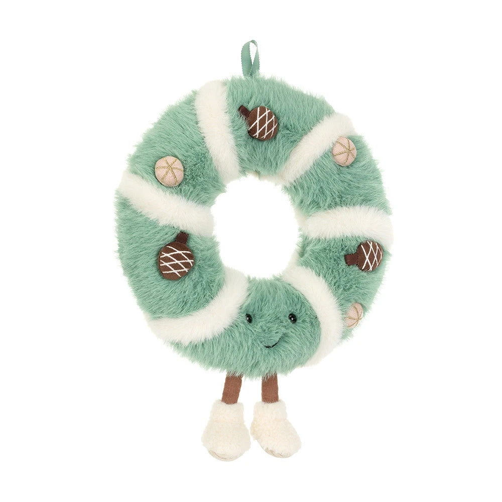 Plush green and white striped wreath with pinecone accents, a smiling face, and dangling legs.