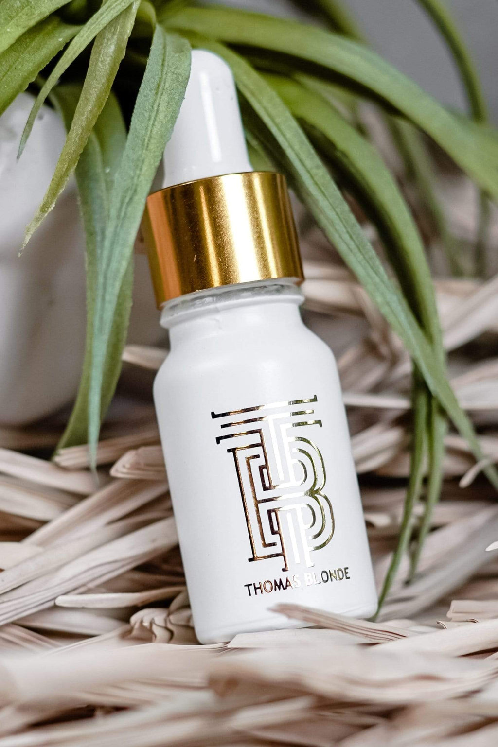 3 in 1 Essential Volumizer Oil bottle with a pump dispenser