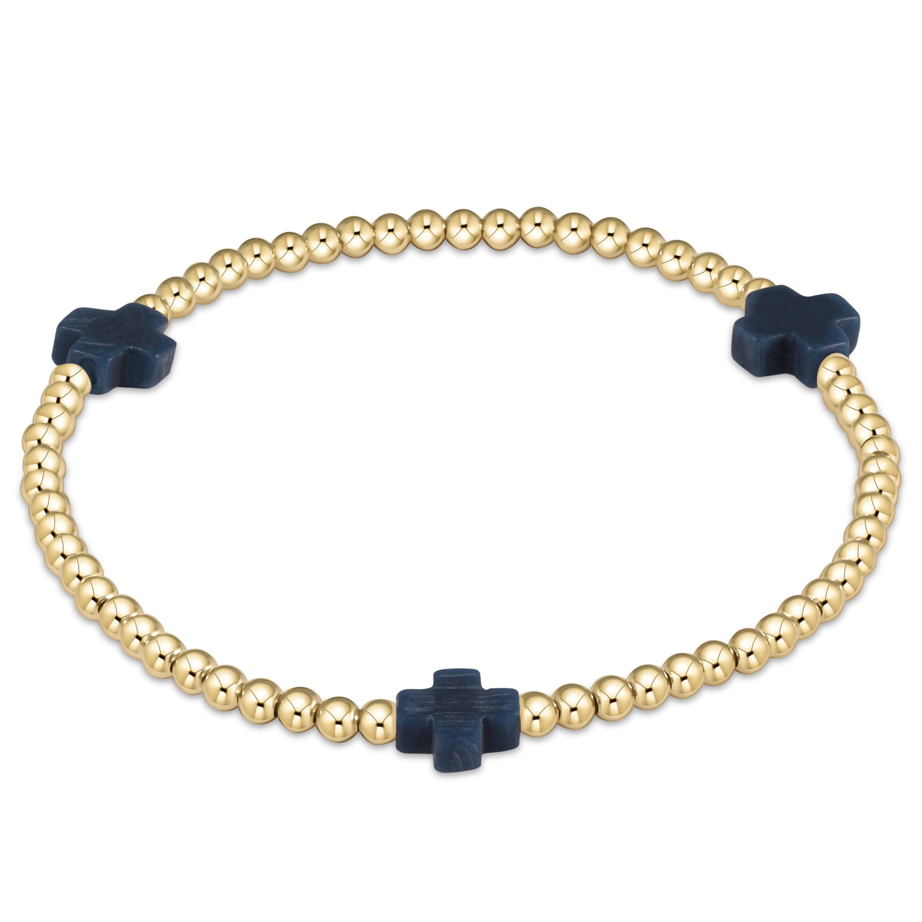 Signature Cross gold-patterned bracelet with 3mm beads on stretch elastic cord