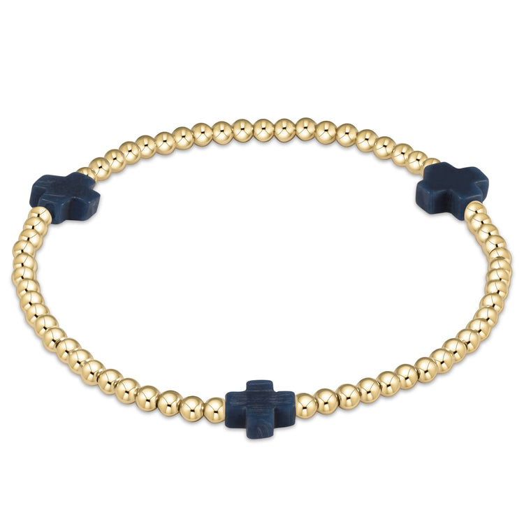 Signature Cross gold-patterned bracelet with 3mm beads on stretch elastic cord